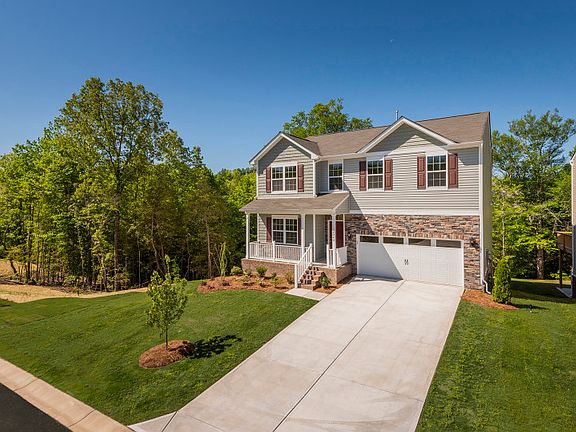 Hampton Exterior 7 features stone, shakes, siding, covered front porch 2 car garage