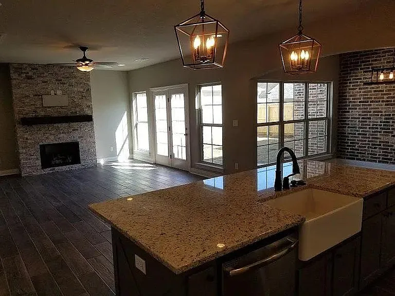 view of the great room and the patio area from the kitchen