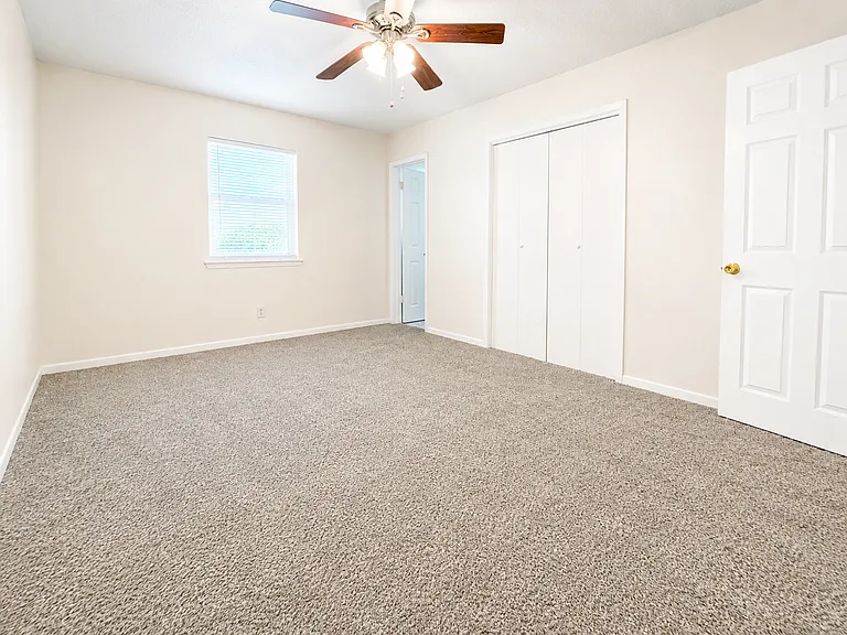 Primary bedroom with half bath