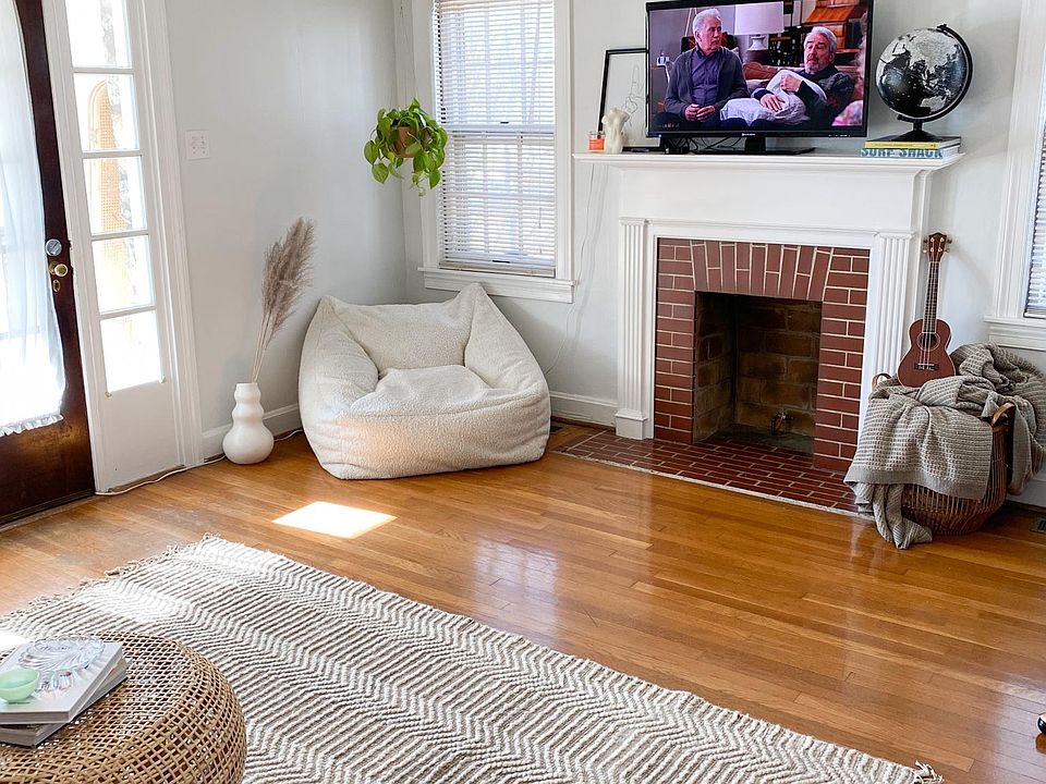 The living room. Unfortunately, the fireplace doesn't work, but it's great for ambiance & the mantle is large enough to accommodate most TVs.