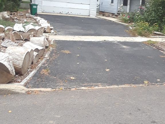 extra large garage with several workbenches and electric for working on projects. Long and wide driv