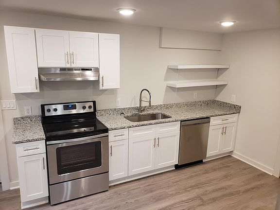 Brand new kitchen top to bottom! Stainless steel appliances, white shaker cabinets, and granite countertops complete a modern look!