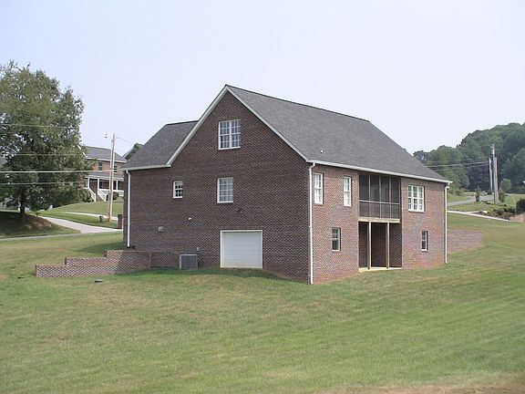 ALL BRICK Rear/Side with third garage door