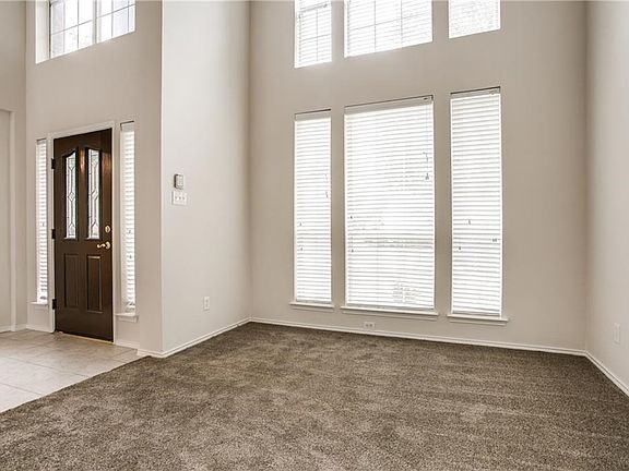 Living room across from the dining room. Fresh paint & new carpet. So much natural light in this home!