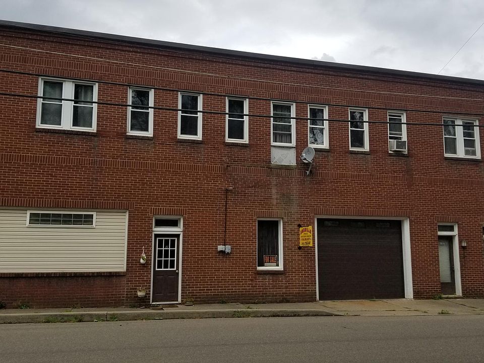 Front of building,Apartment A windows second floor, 5 on left, facing building.