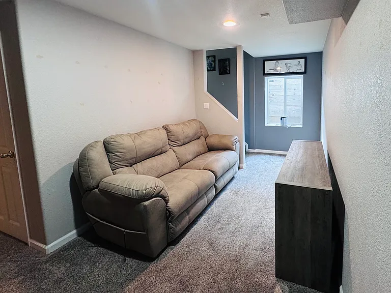 Cozy living room nook located at the bottom of the stairs