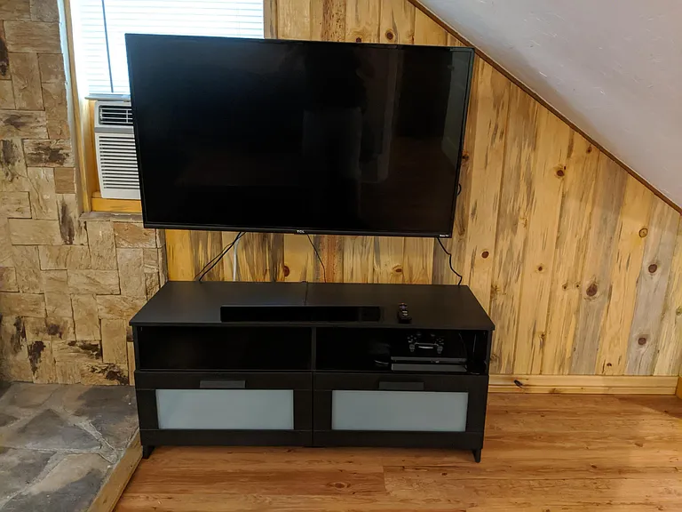 43-inch HD TV and entertainment center. Set up for streaming.