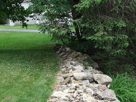 view of rock wall-back border