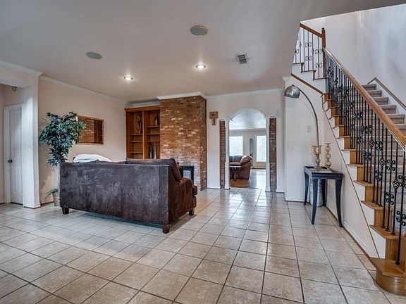 As you enter the home, you are enveloped with tons of natural light