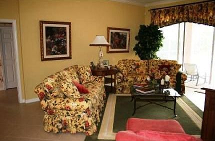 LIVING ROOM W/SLIDERS TO SCREENED LANAI 