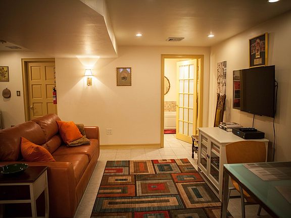 Common Area with Full Size Sleeper Sofa, Flat Screen TV and Kitchen Table