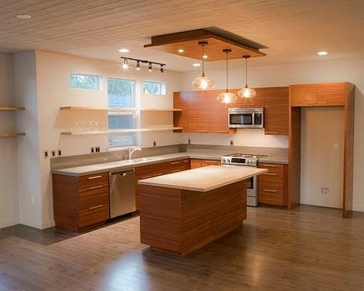 Mahogany cabinetry, open shelving, ample natural light, Fisher & Paykel refrigerator (not pictured).