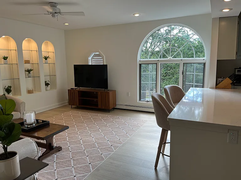 The large palladian window brings in the sun and views of the outdoors.