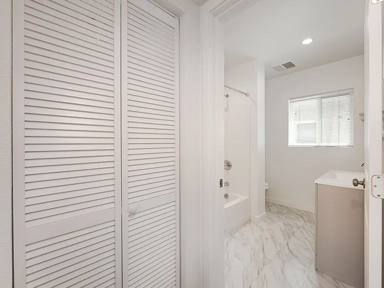 Laundry (washer & Dryer) Closet leading into Bathroom