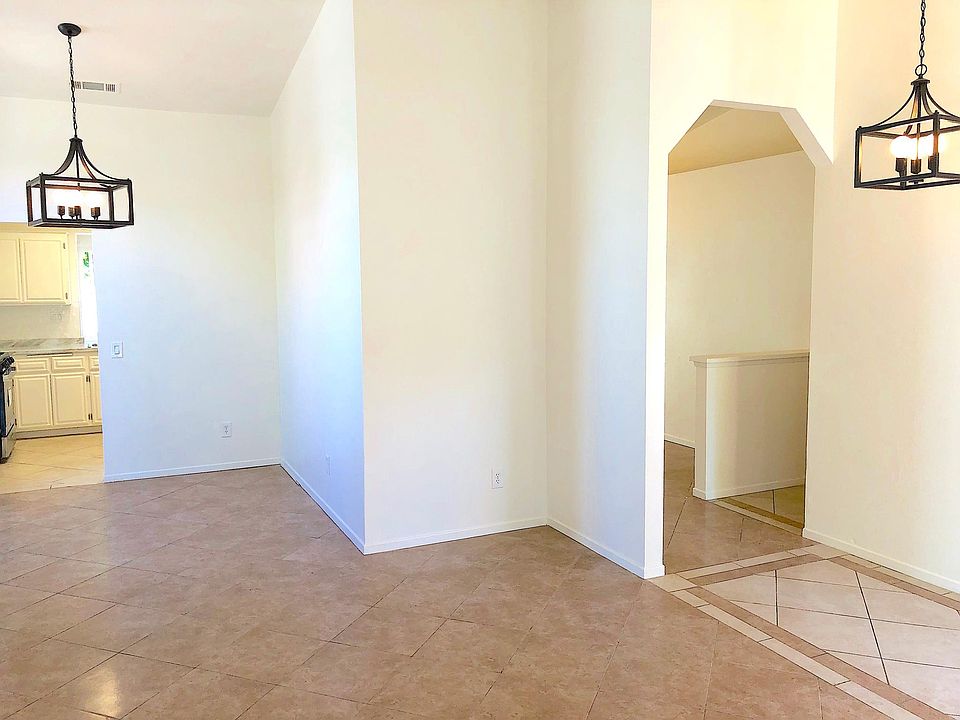 Vaulted ceilings, modern light fixtures, designer tile floor throughout and much more!