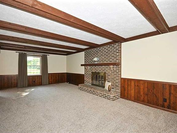 Great Room. Rustic appeal and new carpeting complete this cozy family area.