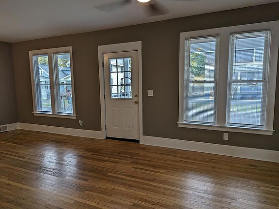 Living Roon with several large windows to let in natural lgiht