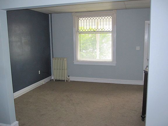 Front room, lots of natural light from the large window.
