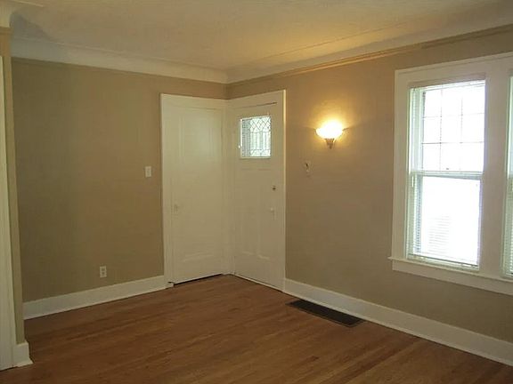 Living room and upper balcony access