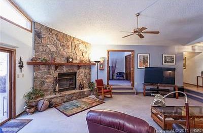 Full moss rock wall fireplace with large mantle - makes nice foc