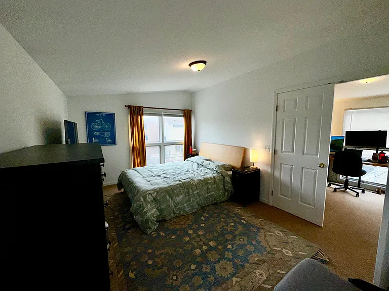 LARGE BEDROOM WITH CATHEDRAL CEILINGS, ACCESS DIRECTLY TO BATH AND OUTSIDE THE DOOR TO THE LOFT/OFFCE/WORKOUT AREA.