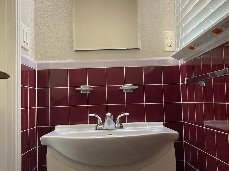 A view of the Half Bath with medicine cabinet