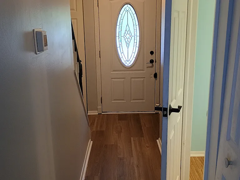 Downstairs hallway with half bath.