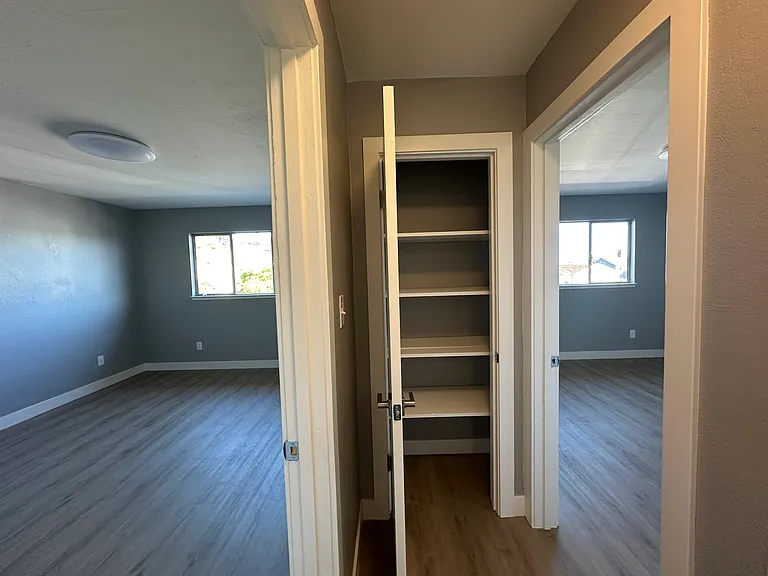 Linen closet at the end of the hallway