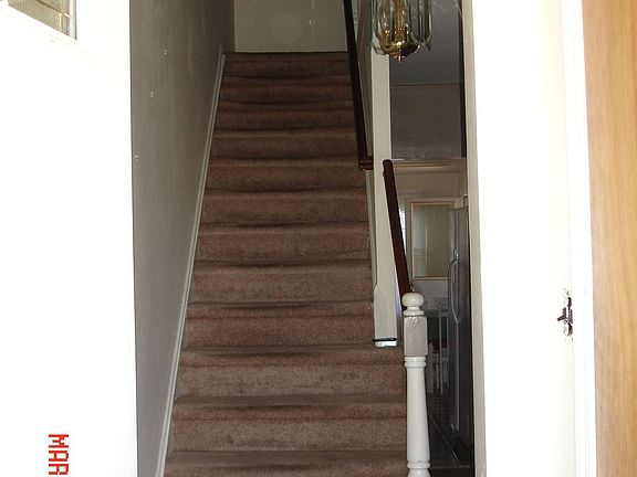 Hallway and Carpeted Stairs to 2nd Flr