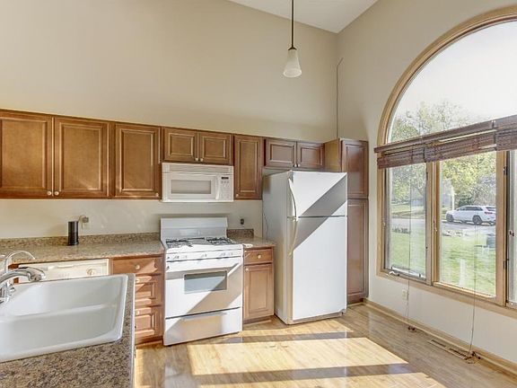 Bright and sunny kitchen with large window.