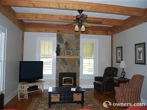 living room with wood burning stove