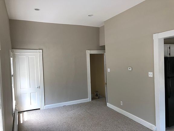 Light-filled living room off of kitchen