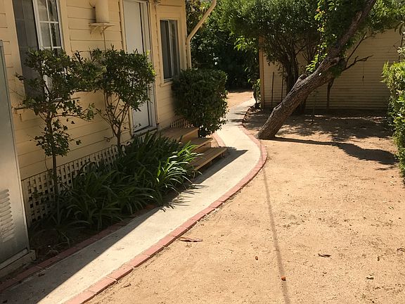 Bedroom door leads out to side yard