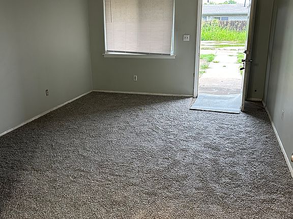 Living Room looking from Dining Area toward front door.