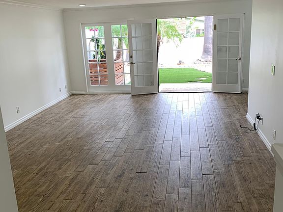 Living room to back garden. (This room is rented unfurnished) (please see next image for AI generated idea of how it could be designed)