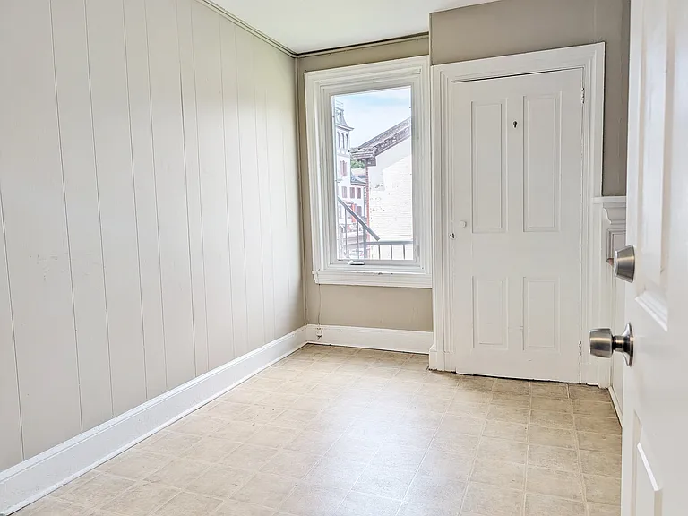 Dining area in the kitchen w/ pantry closet.