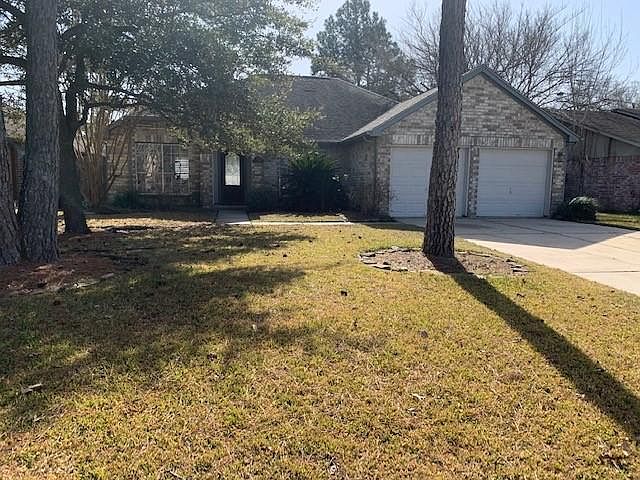 Street view, mature trees and crape myrtles.