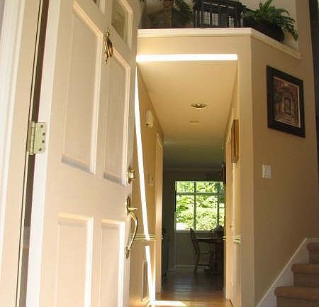 Welcome Home! Entry features hardwood floors and vaulted ceilings