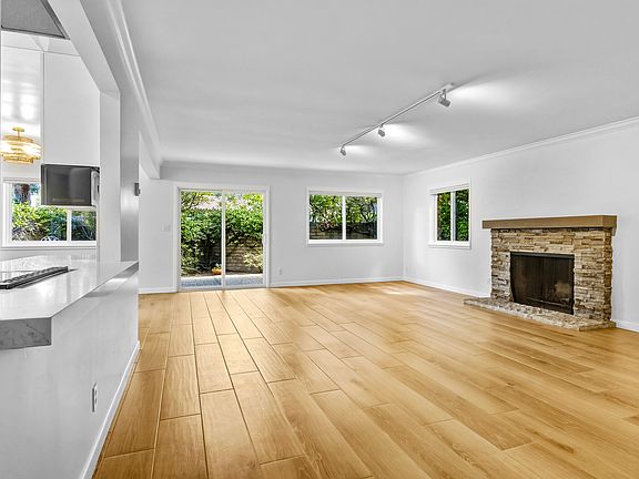 Wood-look tile floor and fireplace in great room