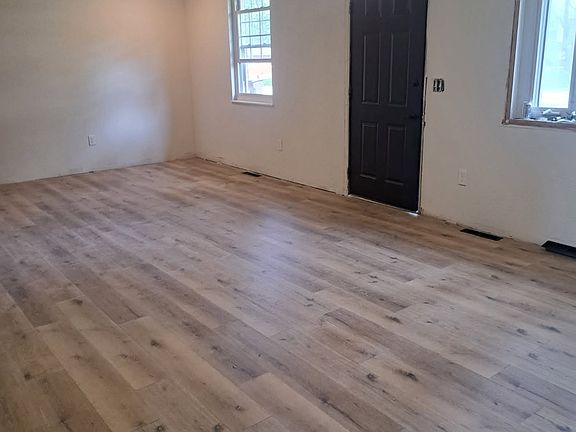Large open living space with new flooring