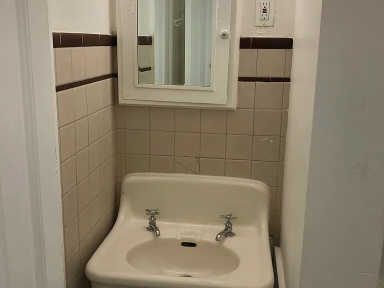 hollywood lights above and medicine cabinet