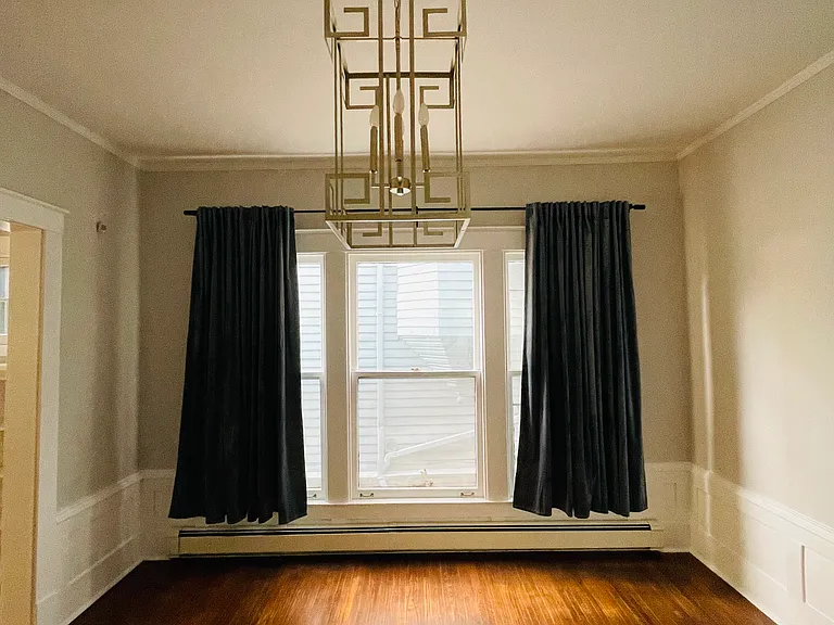 Dining room with custom gold leaf chandelier.