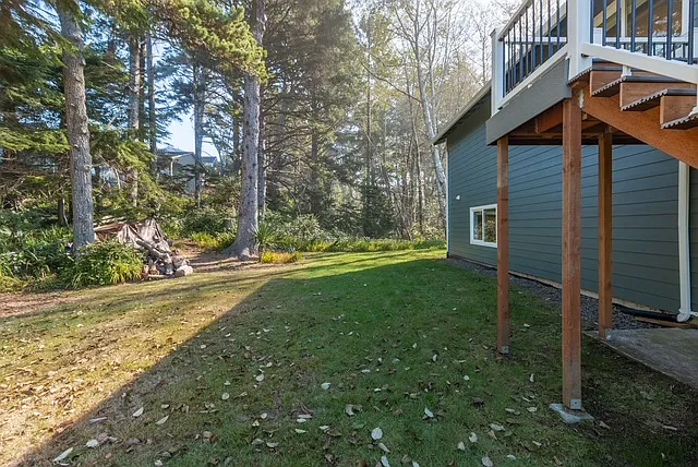 Beach out front. Forrest in the back.