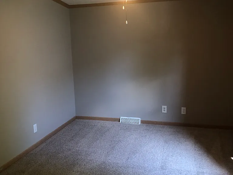 Bedroom #3 with Walk In Closet and new carpet throughout.