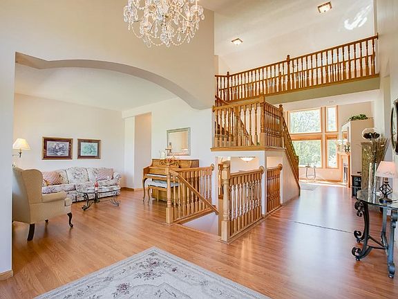 As you walk in to the home you are welcomed by this grand entry way showcasing vaulted ceilings,  and tons of natural light. The room to the left is a wonderful sitting room or can be used for a formal dining room as it leads to the kitchen.