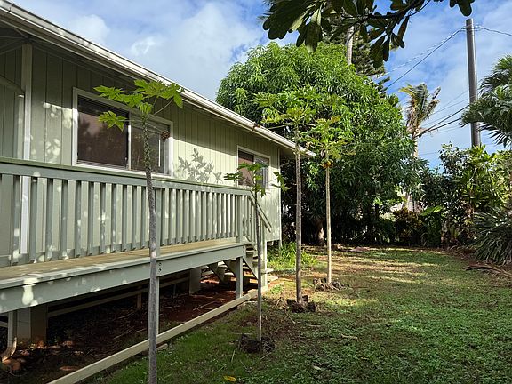 Side yard, with wrap around Lanai that goes into the back yard.