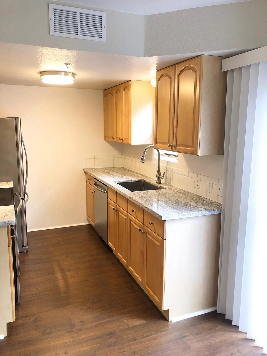 Kitchen with granite counters, deep sink and single lever faucet with pull out spray. - 3609 Bickerstaff Rd