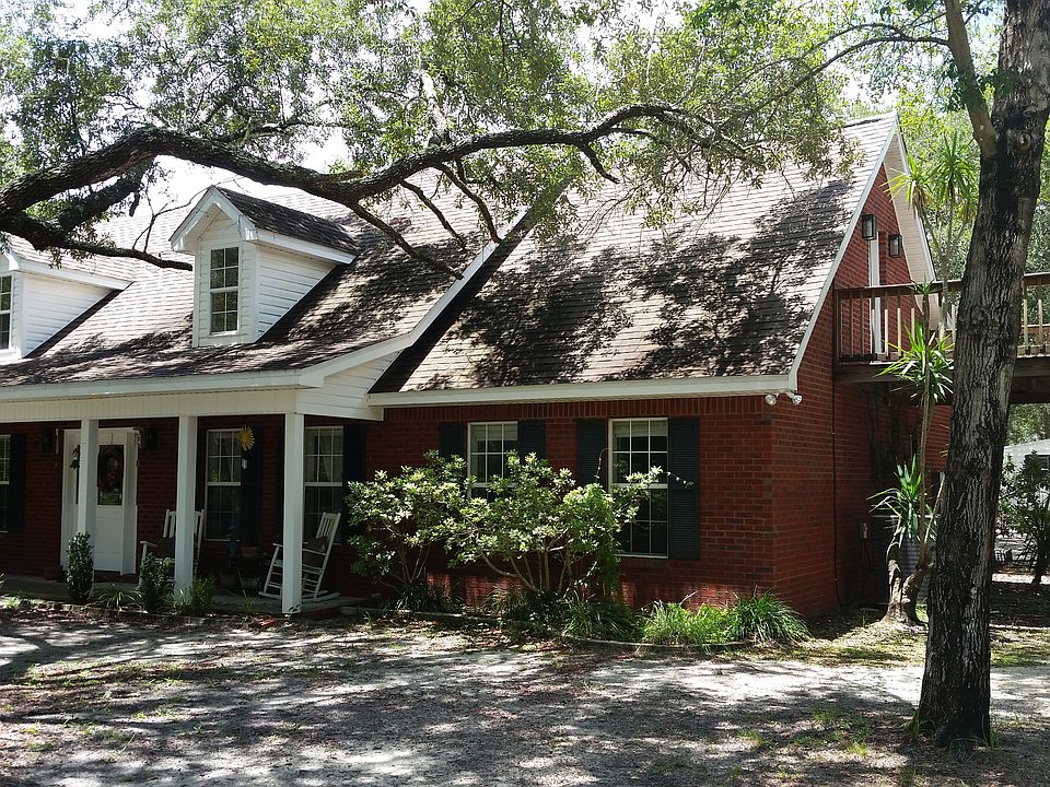 Front/side showing upstairs balcony