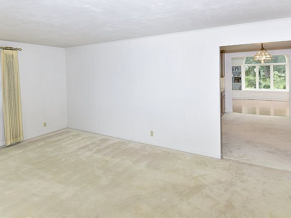 Opens to Kitchen and Family Room