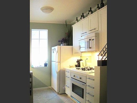 Kitchen - gas cook top, oven and microwave. Refrigerator has ice maker.